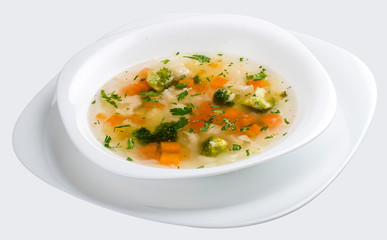 Vegetable soup with broccoli on white background