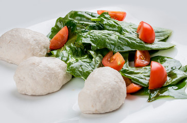 Diet chicken cutlets with salad and tomatoes. On white background