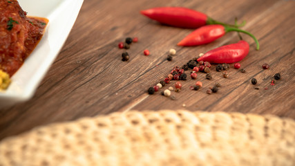 pepper and spices on wooden background