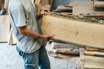 High quality wood concept. Cropped photo profile side view of cabinetmaker or handcraft man hold...
