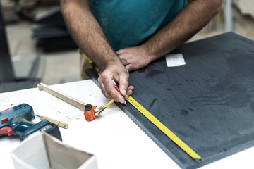 Design wood concept. Cropped photo of cabinetmaker handyman trad