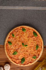 Yummy pizza near piece of cloth