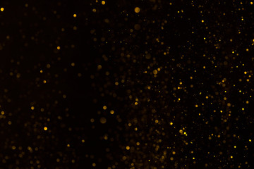 Shiny glitter fall abstract background on black