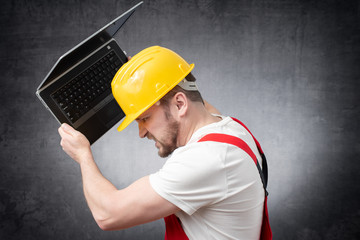 Construction worker with laptop