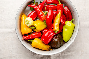 Crop of pepper in bowl with water, fresh food