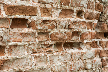 texture of old brick wall with potholes and plaster