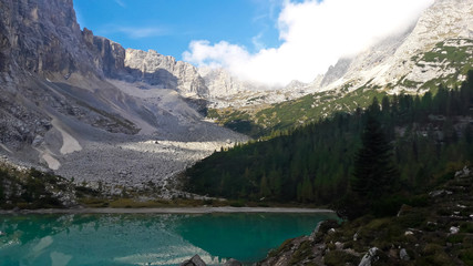 Fototapeta na wymiar Dolomites, Italy. Lake Sorapis (Lago di Sorapis) in Dolomites, popular travel destination in Italy. Trentino Alto Adige