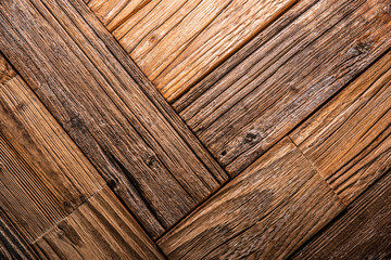Old dark brown wooden wall, detailed background photo texture. Wood plank fence close up.