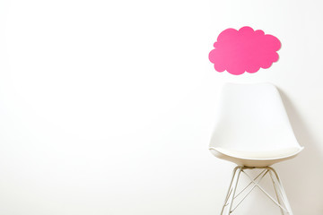 Empy loft style chair over blank wall background wit a lot of copy space for text. Available job position, interview or negotiations concept.