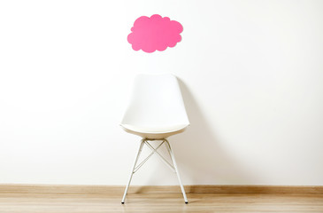 Empy loft style chair over blank wall background wit a lot of copy space for text. Available job...