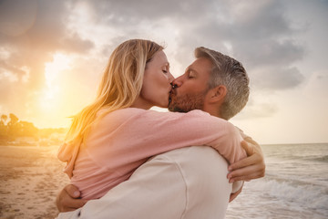 couple embracing happy on the beach