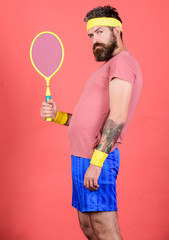 Man bearded hipster wear old school sport outfit with bandages. Tennis can be an effective way to...