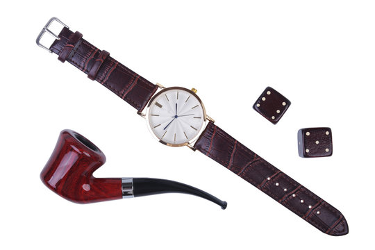 Men's accessories for business and rekreation. Watch, smoking pipe and dice isolated on white background.. Top view composition.