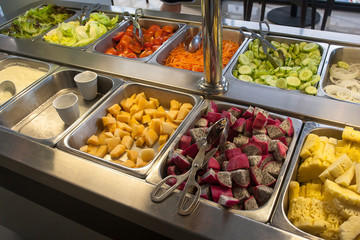 Buffet at the hotel with crutches, vegetables, cheese and sauces