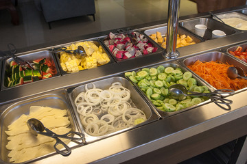 Buffet at the hotel with crutches, vegetables, cheese and sauces