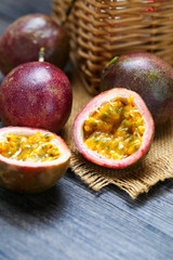 fresh passion fruit on dark wooden table