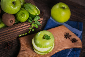 Set of green fruits for healthy diet and detox: apple, lime, kiwi, mango, carambola and mint.
