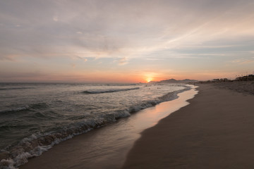 beautiful sunset on the reserve beach (praia da reserva), recreio dos bandeirantes, rio de janeiro - brazil