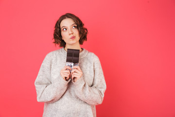 Portrait of a pensive young woman standing