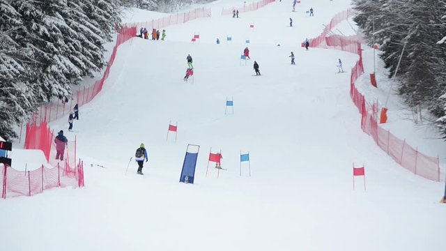 Jahorina mountain, BiH, February 13th 2019, Alpine skiing. Skier skiing down mountain during competitions in alpine skiing. Athletes on snow at winter sport games. Open championship on giant slalom ra