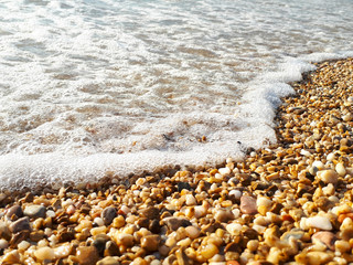 Waves rolling on a pebble beach, beautiful landscape