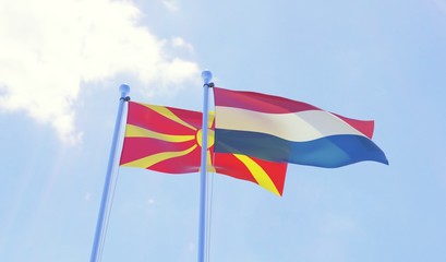 Macedonia and Netherlands, two flags waving against blue sky. 3d image