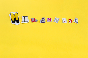 Word Millennial formed with cut out letters on yellow background. Millennial, the generation of the media and digital technologies with copy space.