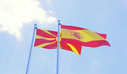 Macedonia and Spain, two flags waving against blue sky. 3d image