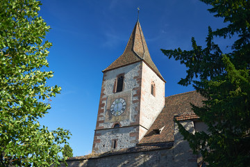 Architecture of buildings in a village in rural French town in the Alsace area in summer sunshine