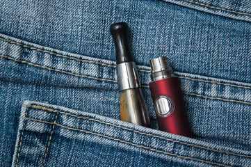 closeup of e cigarette in blue jeans pocket