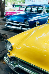 Vintage american cars parked on the street in downtown Havana