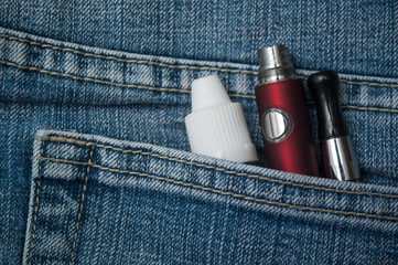 closeup of e cigarette in blue jeans pocket