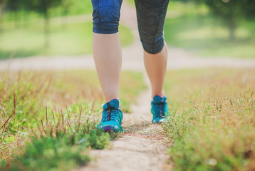 Young fitness woman legs running. Healthy lifestyle