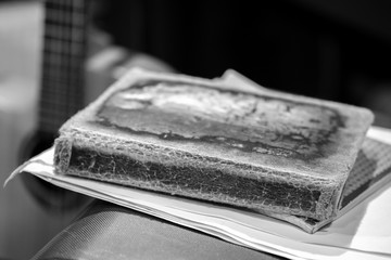 black-and-white picture book with a shabby cover very old, the background of the fingerboard