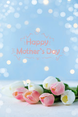 Phrase Happy Mother's Day on a bright background with flowers, bouquet. Congratulate this postcard.