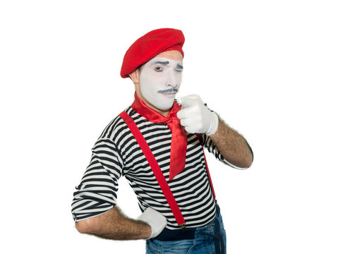 Cheerful mime, isolated on white. Man, as a pantomime actor, showing ok sign and looking at camera.