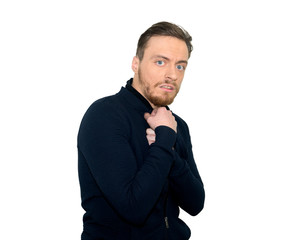 young man looking shocked scared trying to protect himself from unpleasant situation isolated on white background