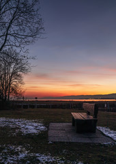Bench. Sunset. Sundown. Peaceful. Color. Water. Lake