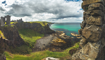 The overview from Dunluce castle to the Irish bay. Overwhelming Northern Ireland landscape. Epic...