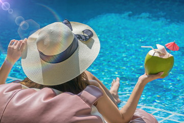 woman relaxing in swimming pool spa. Cute girl is relaxing in the pool.Relax pool spa.