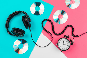 Headphones with cord on a bright color block background