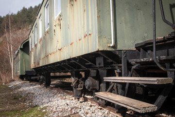 Old freight train containers with narrow gauge railway track