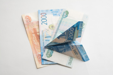Airplane from the money. Money on a white background