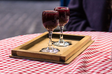 Two glasses of wine on the table.