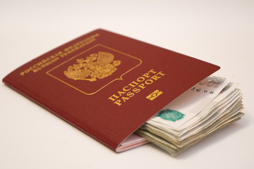 Russian passport and banknotes in denominations of 1 thousand rubles