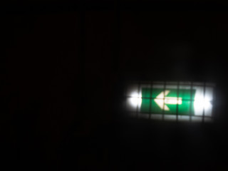 fire exit, sign in the tunnel, blurred