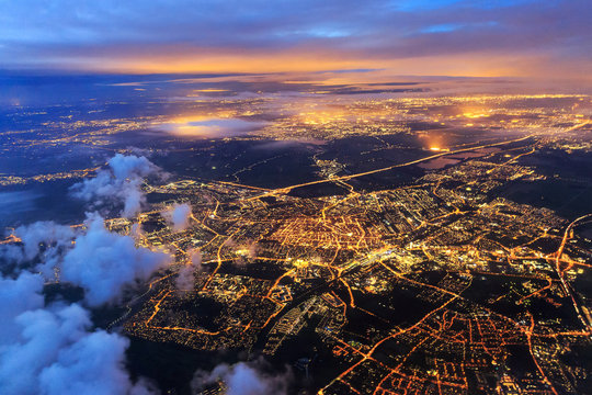 Fototapeta Beautiful aerial cityscape view of the city of Leiden, the Netherlands, after sunset at night in the blue hour