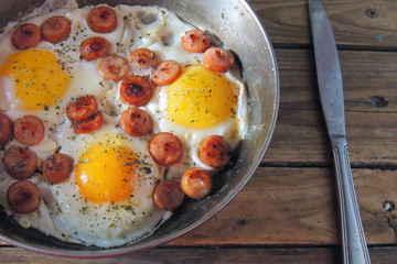 fried eggs with sausages