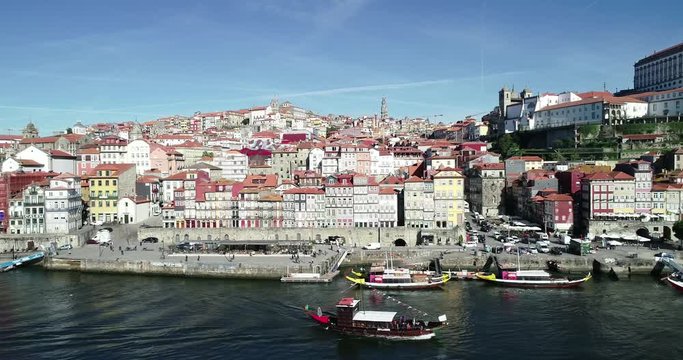 Drone shot of Douro River shore, in Porto, Portugal, with its many traditional houses.