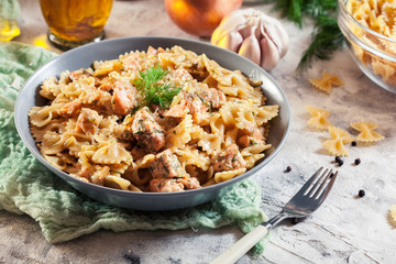 Creamy farfalle pasta with salmon, parmesan cheese and dill